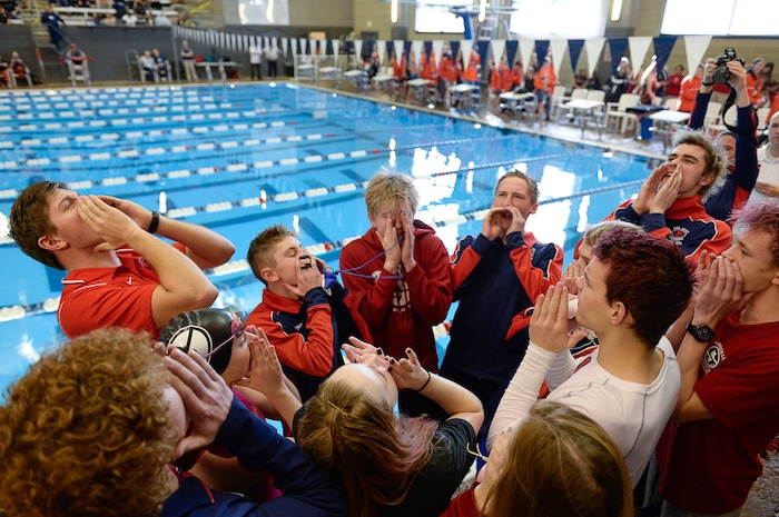 (Francisco Kjolseth | The Salt Lake Tribune) The Springville team gets pumped up before the start of the high school swimming 5A State Championships in Bountiful, Friday February 9, 2018.