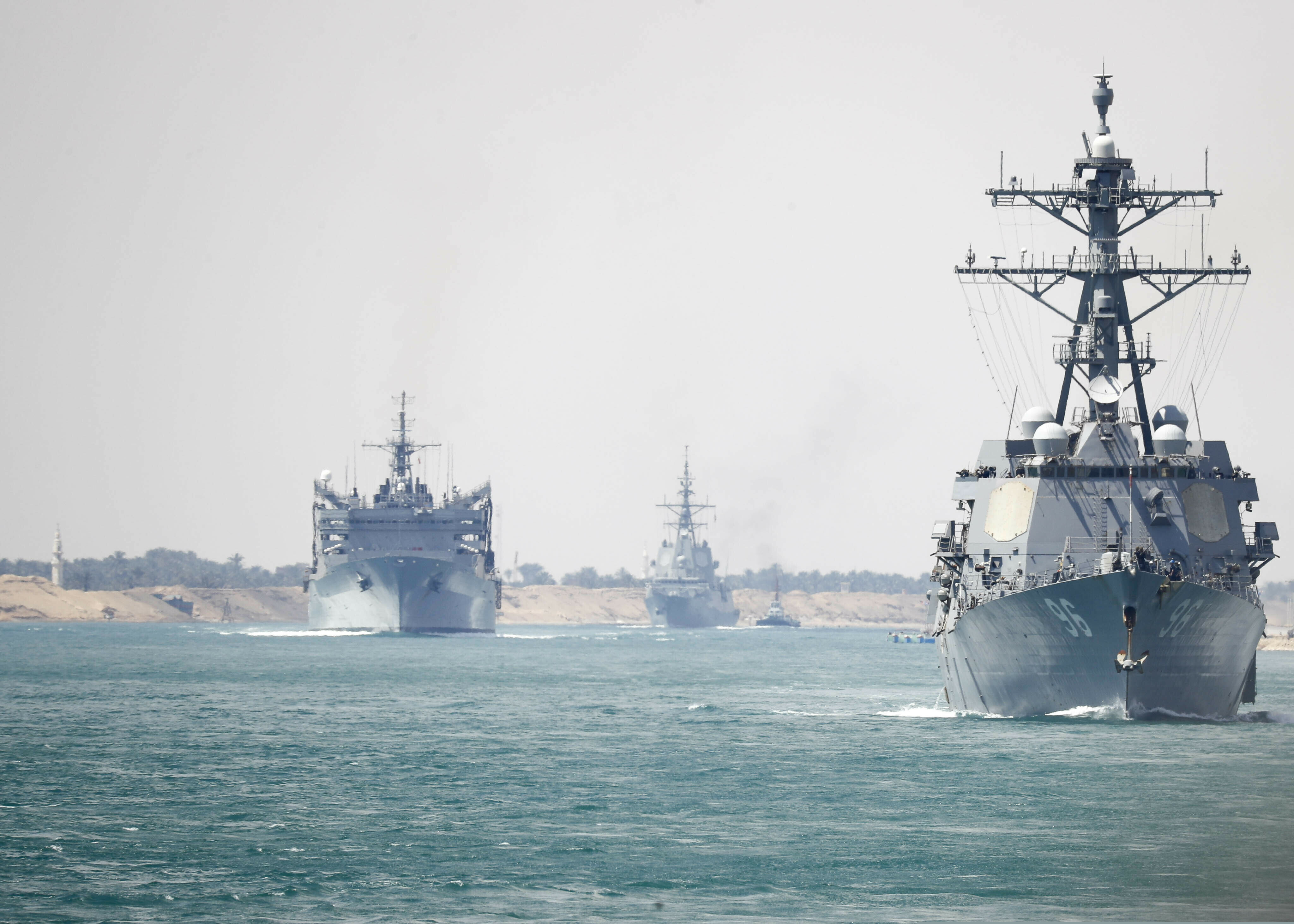 In this Thursday, May 9, 2019 photo released by the U.S. Navy, the Abraham Lincoln Carrier Strike Group transits the Suez Canal in Egypt. The aircraft carrier and its strike group are deploying to the Persian Gulf on orders from the White House to respond to an unspecified threat from Iran. (Mass Communication Specialist 3rd Class Darion Chanelle Triplett/U.S. Navy via AP)