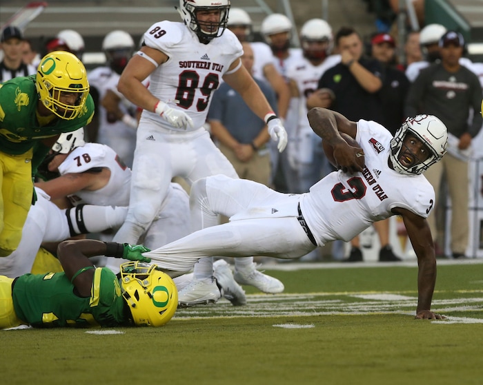 Oregon's LaMar Winston Jr., left, pulls down Southern Utah quarterback Patrick Tyler during the third quarter of an NCAA college football game Saturday, Sept. 2, 2017, in Eugene, Ore. (AP Photo/Chris Pietsch)