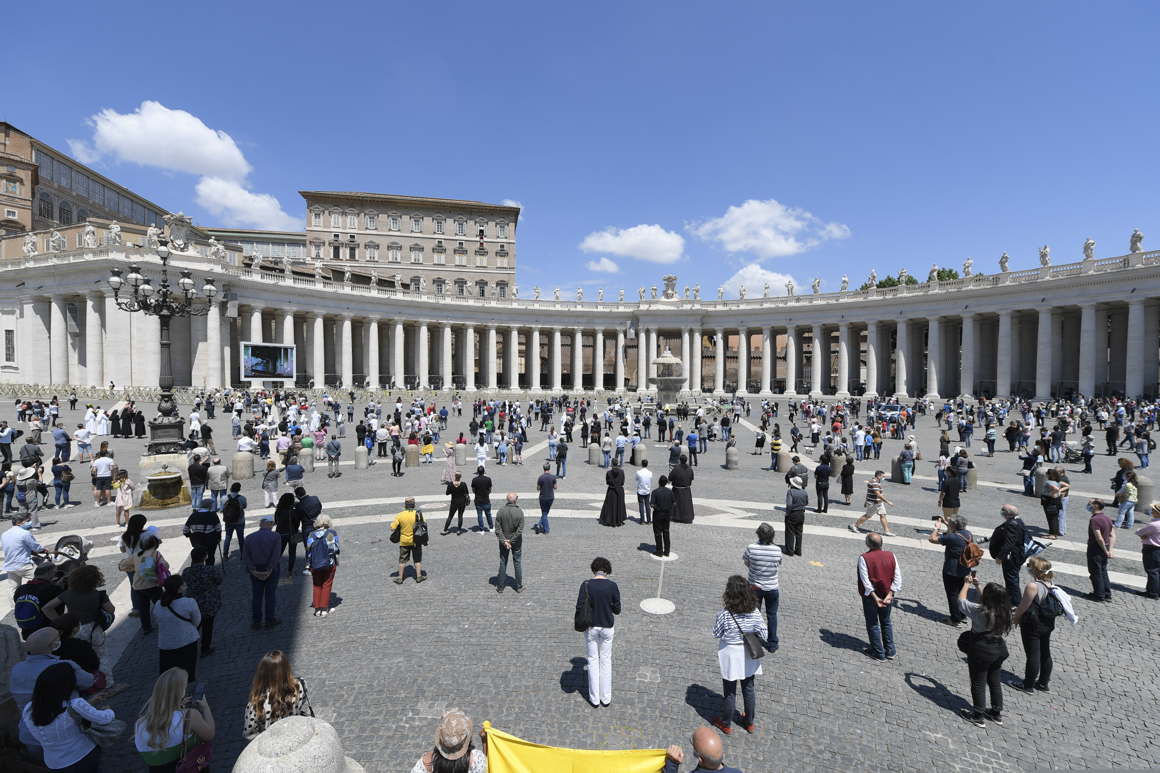(Vatican News via AP) Faithful gather in St. Peter's Square at the Vatican, Sunday, May 31, 2020.