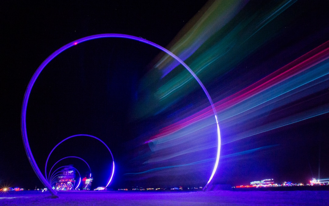 (Rick Egan  |  The Salt Lake Tribune)   A bike speeds down the Sconic Runway by Warren Trezevant and Rob Jensen, at Burning Man, during Burning Man, a week long celebration of art and radical self expression, in the Black Rock Desert in Nevada, Friday, August, 30, 2018.