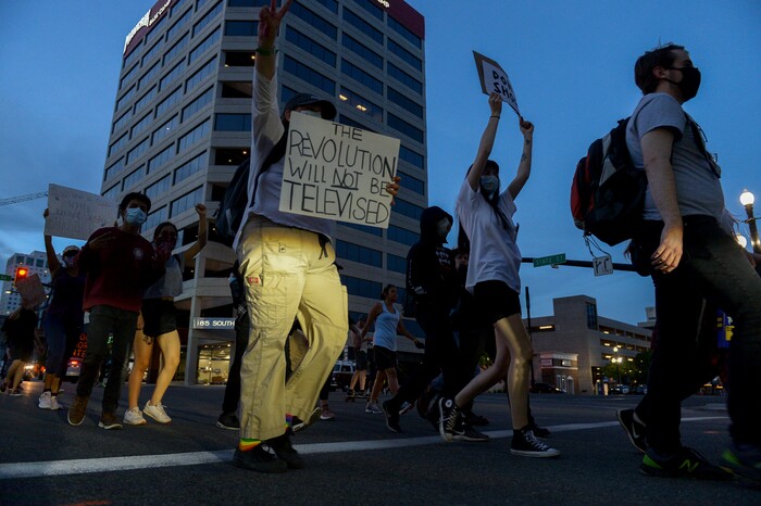 (Leah Hogsten  |  The Salt Lake Tribune) Protesters walk down State Street against police brutality in Salt Lake City on Monday, June 1, 2020.