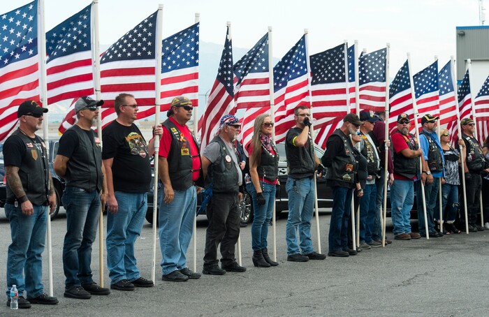 (Rick Egan  |  The Salt Lake Tribune)      
The Patriot Guard Riders of Utah, hold flags as they await the remains of Marine Pfc. Robert K. Holmes at Delta Air Cargo. Holmes died aboard the USS Oklahoma during the attack on Pearl Harbor. Friday, Aug. 17, 2018.
