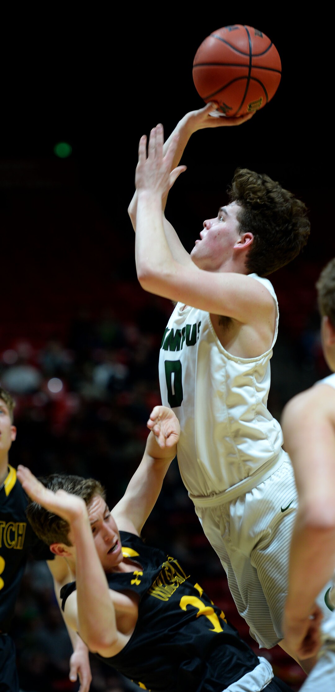 Steve Griffin  |  The Salt Lake TribuneOlympus guard Jeremy DowDell shoots the ball as he crashes into Wasatch guard Brandon Maxwell during 4A playoff game at the Huntsman Center in Salt Lake City Tuesday February 28, 2017.