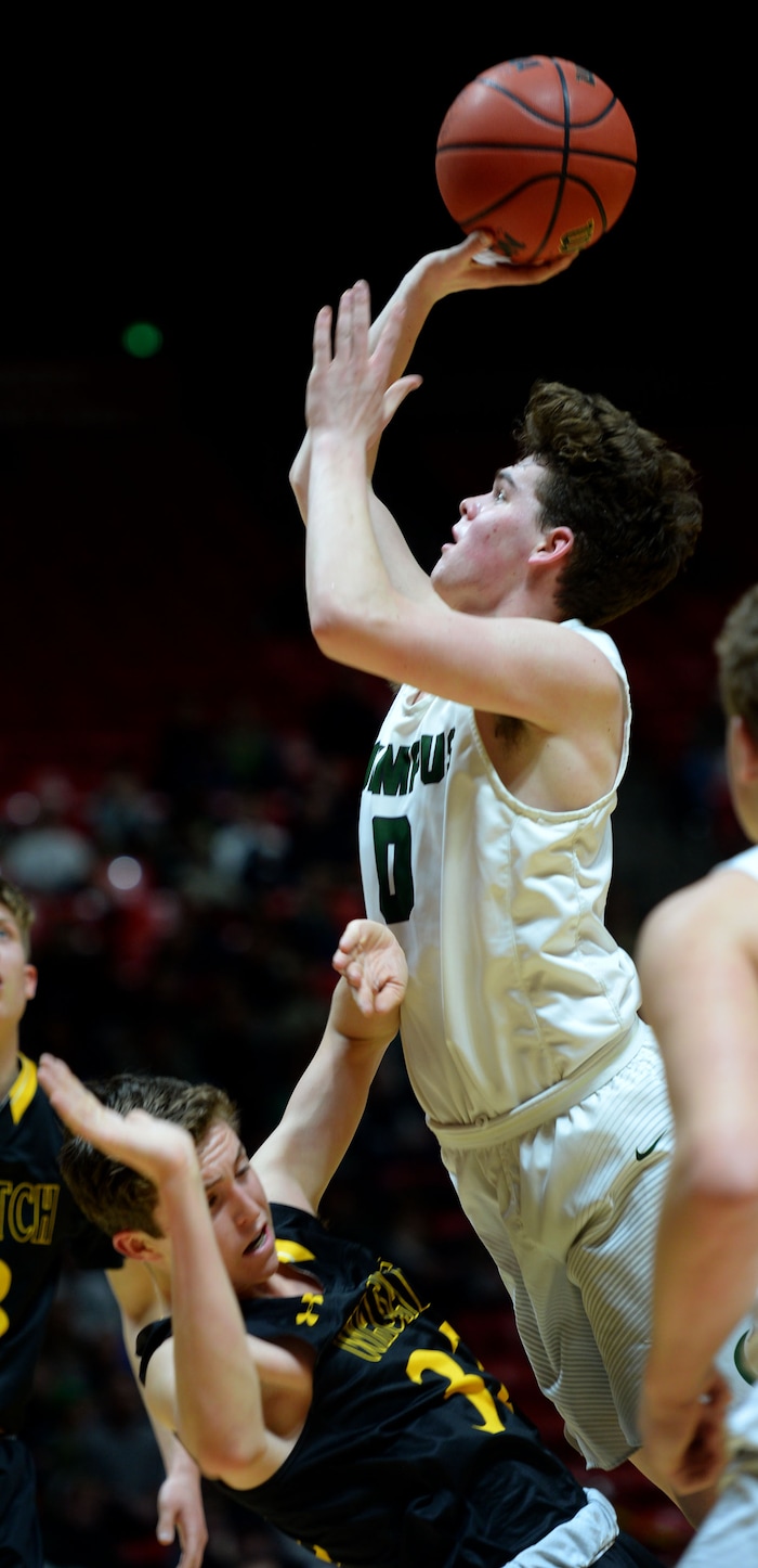 Steve Griffin | The Salt Lake Tribune
Olympus guard Jeremy DowDell shoots the ball as he crashes into Wasatch guard Brandon Maxwell during 4A playoff game at the Huntsman Center in Salt Lake City Tuesday February 28, 2017.