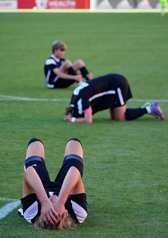(Francisco Kjolseth | The Salt Lake Tribune) Davis players lie on the floor in defeat following their loss in the last two seconds of play in the 6A State Soccer Championship title game against Herriman at Rio Tinto Stadium, Wednesday, May 25, 2022. Herriman defeated Davis 1-0.