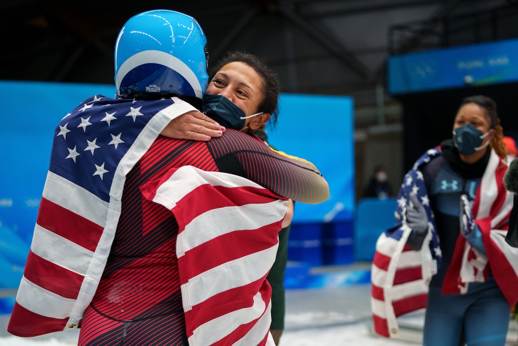 (Trent Nelson | The Salt Lake Tribune) Bronze medalist Elana Meyers Taylor, center, embraces German gold medalist Deborah Levi after the 2-woman bobsled at the 2022 Winter Olympics in the Yanqing district of Beijing on Saturday, Feb. 19, 2022. At right is Sylvia Hoffman.