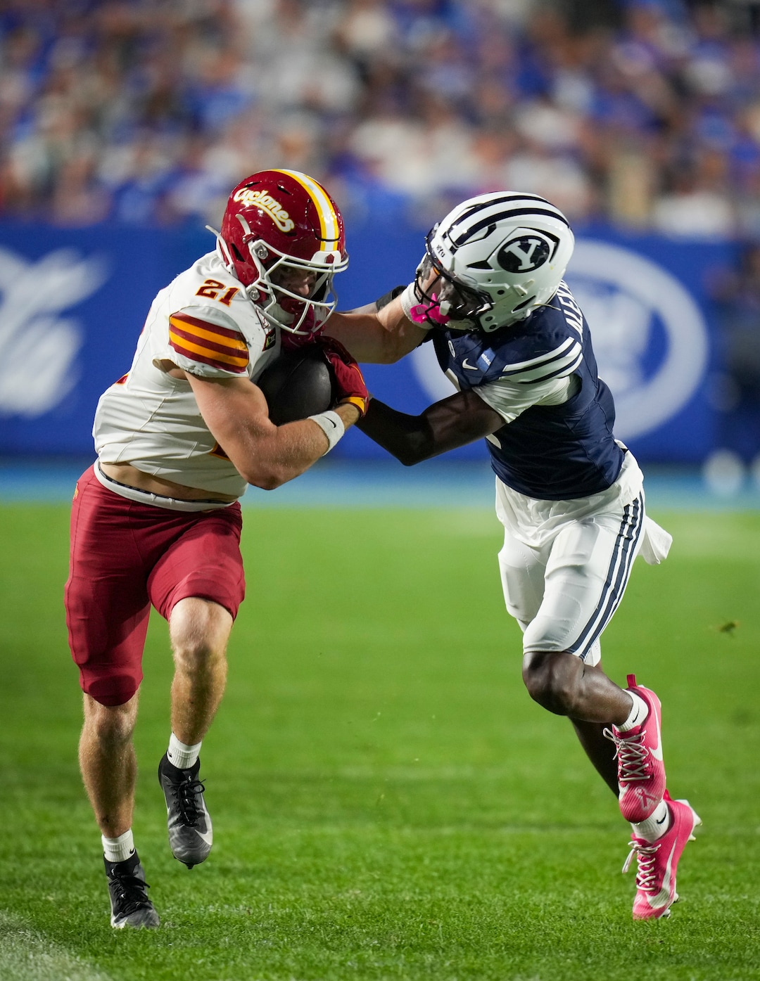 (Bethany Baker  |  The Salt Lake Tribune) Iowa State Cyclones running back Aiden Flora (21) avoids a tackle by BYU Cougars cornerback Therrian Alexander (1) during the game between the BYU Cougars and the Iowa State Cyclones in Provo on Friday, Oct. 9, 2026.