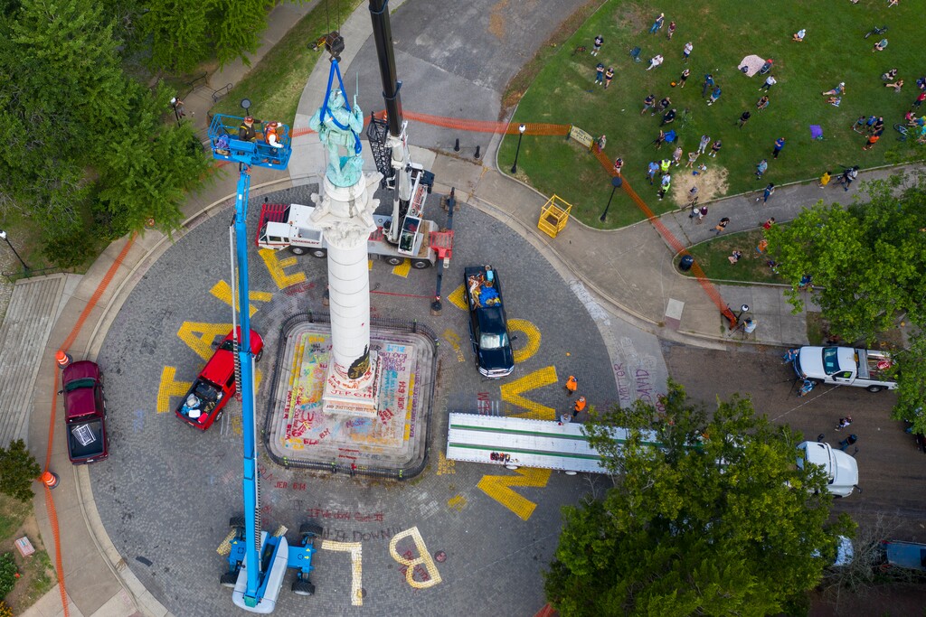 (Steve Helber | AP file photo)  Crews work to remove the Confederate Soldiers & Sailors Monument in Libby Hill Park, Wednesday, July 8, 2020, in Richmond, Va.