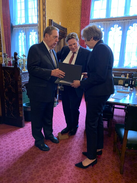 (Courtesy photo | The Church of Jesus Christ of Latter-day Saints)
British Prime Minister Theresa May is presented personal copies of her family history by apostle Jeffrey R. Holland.