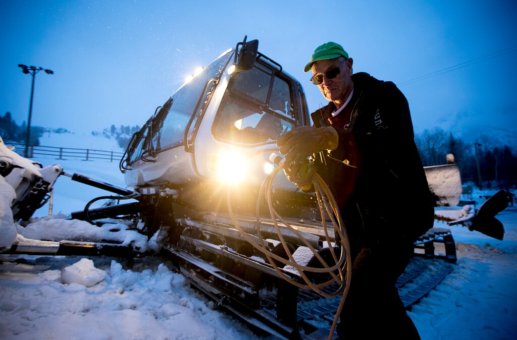 (Isaac Hale | The Daily Herald via AP) Jerry Hill, 75, director of mountain maintenance at Sundance Mountain Resort, unplugs a block heater, which keeps engines warm through cold weather, as he prepares to inspect the mountain in a snowcat before the resort opens on Thursday, Jan. 30, 2020, in Provo Canyon near Provo, Utah.