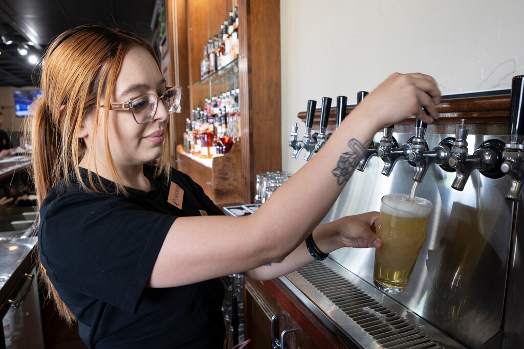 (Rick Egan | The Salt Lake Tribune) Savanna Boome pops a Beach Bunny Beer at the Rabbit's Foot in West Valley, on Monday, June 16, 2025.