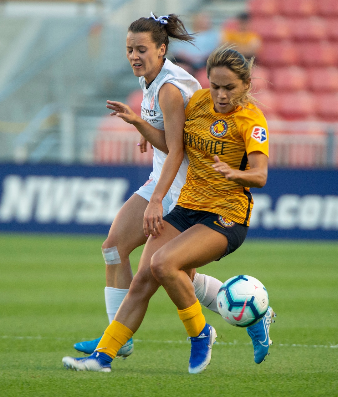 (Rick Egan  |  The Salt Lake Tribune)    Utah Royals FC midfielder Lo'eau LaBonta (9) goes for the ball along with Portland Thorns FC defender Elizabeth Ball (27), in Soccer action between Utah Royals FC and Portland Thorns FC, in Sandy, Friday, July 19, 2019.