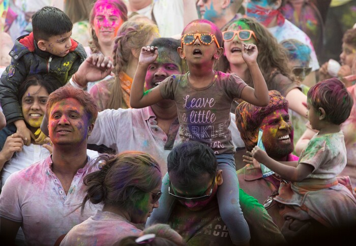 (Rick Egan  |  The Salt Lake Tribune)       Revelers dance to the sounds of Aakansha Bollypop, during the 22nd annual Holi Festival of Colors at the Sri Sri Radha Krishna Temple in Spanish Fork, Saturday, March 24, 2018. The festival which celebrates the beginning or spring is also known as at the Festival of Love.