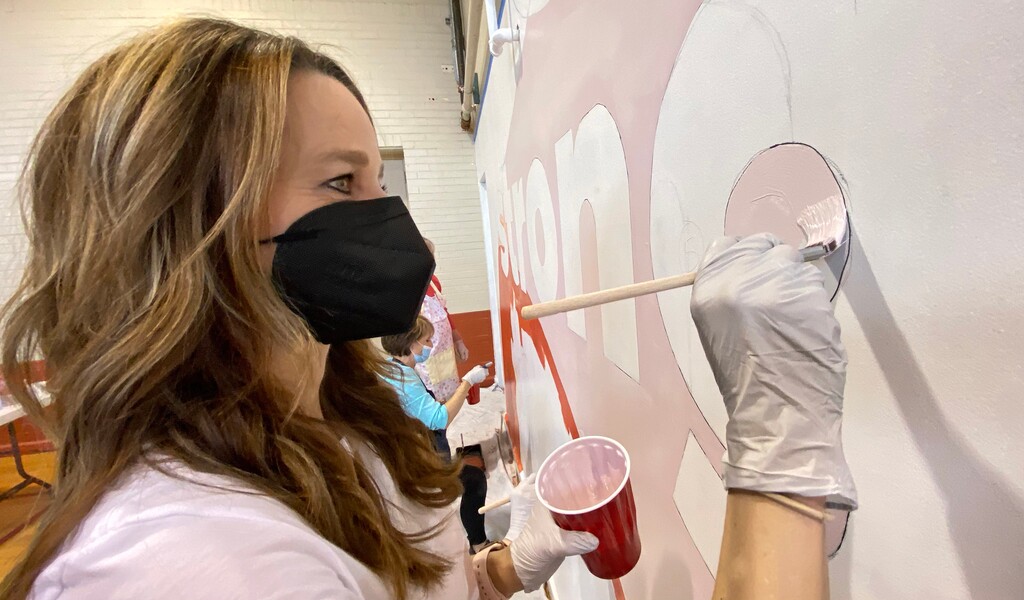 (Rick Egan | The Salt Lake Tribune) ​Utah first lady Abby Cox works on a mural during a day of service at the Utah YWCA on Tuesday, March 2, 2021.