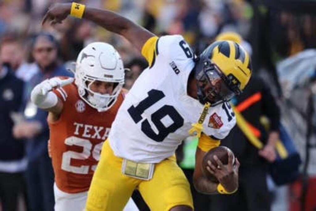 Michigan quarterback Bryce Underwood (19) is pushed out of bounds by Texas defensive back Graceson Littleton during the Longhorns'. victory in the Citrus Bowl on Wednesday, Dec. 31, 2025, in Orlando, Fla.
(Getty Images via The Athletic)