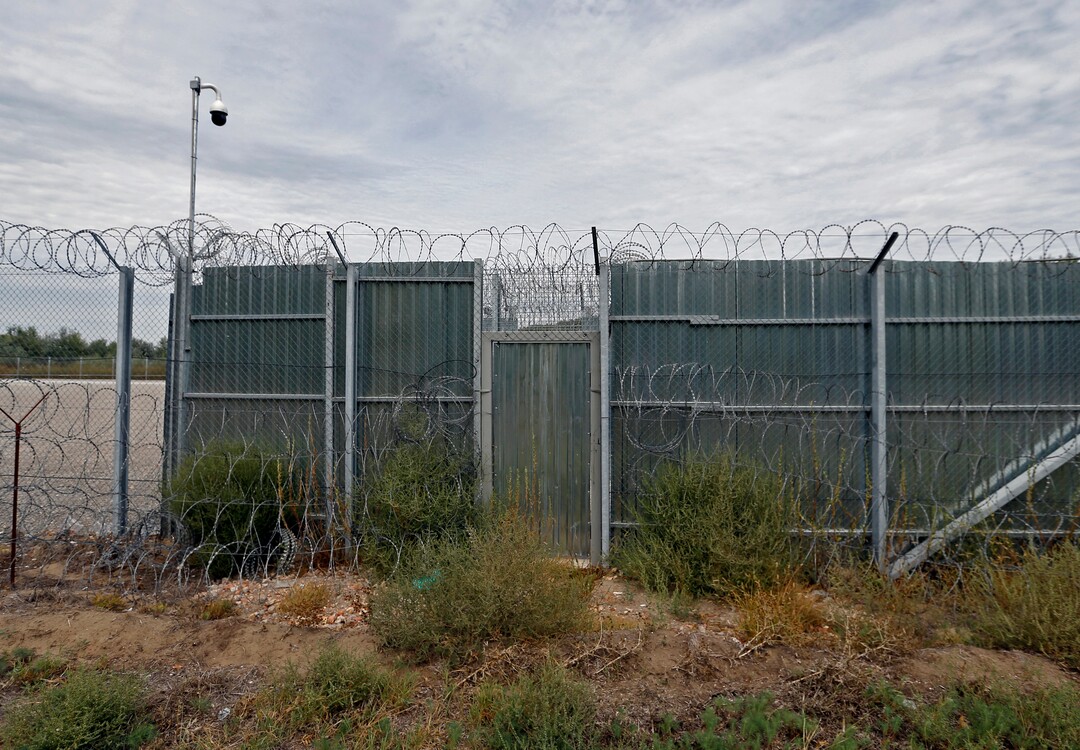 A closed gate of the heavily guarded camp at Serbia's border with Hungary, near the Horgos border crossing, Serbia, Tuesday, Sept. 19, 2017. The European Union border that saw hundreds of thousands of migrants enter freely in 2015 has since become a sealed fortress with two rows of fence and closed camps that the United Nations have described as ''in effect detention centers.'' (AP Photo/Darko Vojinovic)