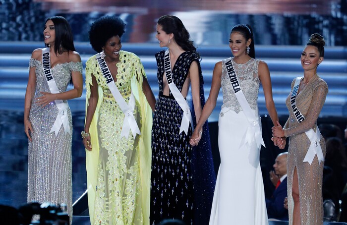 (John Locher | The Associated Press) From left, final five finalists Miss Colombia Laura Gonzalez, Miss Jamaica Davina Bennett, Miss Thailand Maria Poonlertlarp, Miss Venezuela Keysi Sayago and Miss South Africa Demi-Leigh Nel-Peters stand on stage at the Miss Universe pageant Sunday, Nov. 26, 2017, in Las Vegas.