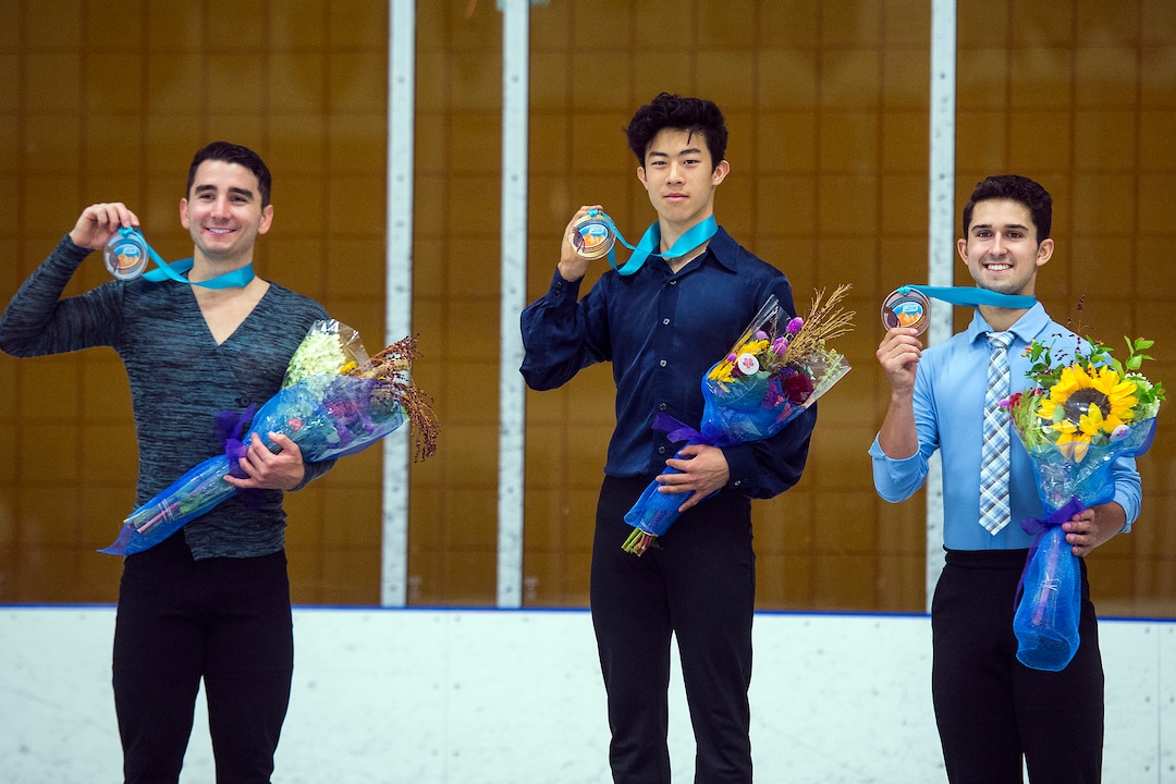 (Chris Detrick  |  The Salt Lake Tribune)   Nathan Chen, center, poses for photos after winning the Men's Free Skate during the U.S. International Figure Skating Classic at the Salt Lake City Sports Complex Friday, September 15, 2017. On left is Max Aaron, 2nd place, and on right is Liam Frius, third place. 