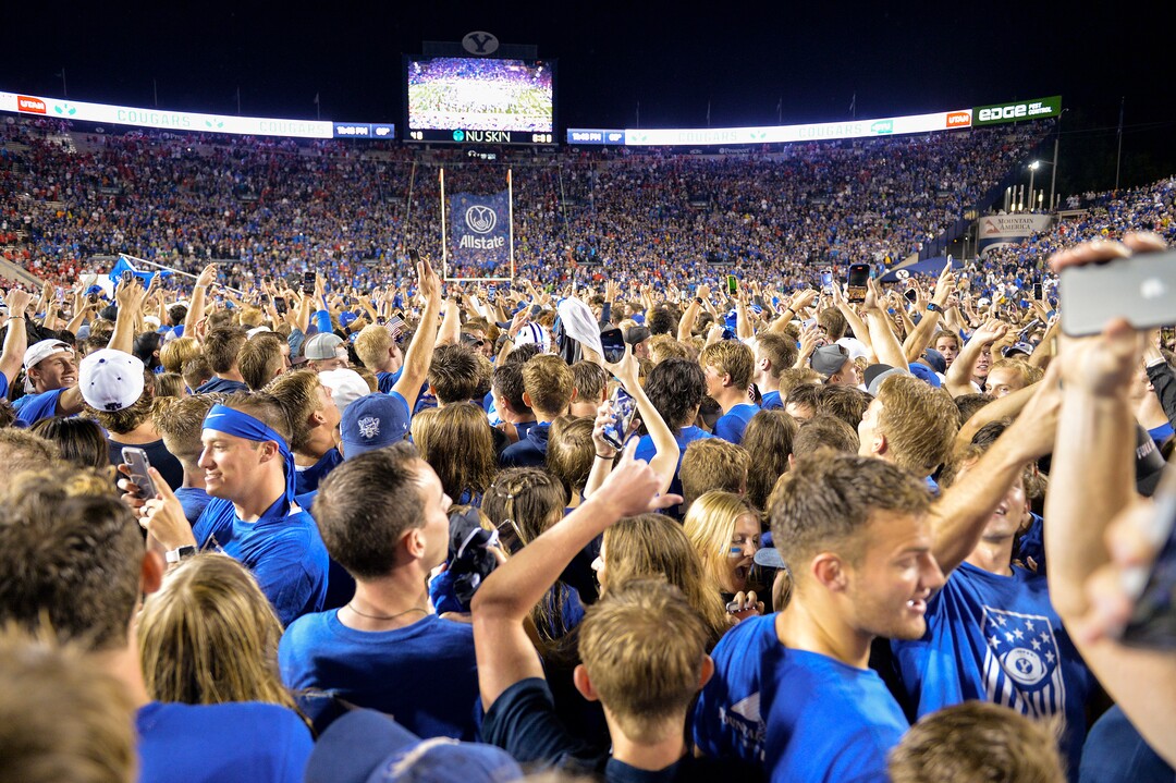 (Chris Samuels | The Salt Lake Tribune) Fans storm the field as the Brigham Young Cougars defeat the Utah Utes 26-17 in football, Saturday, Sept. 11, 2021 in Provo.