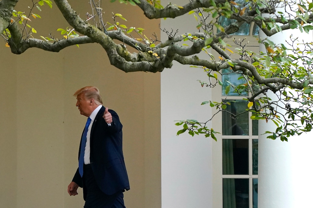 (Patrick Semansky | AP) President Donald Trump gestures to members of the press as he walks to the Oval Office of the White House after visiting the Supreme Court to pay respects to Justice Ruth Bader Ginsburg, Thursday, Sept. 24, 2020, in Washington.