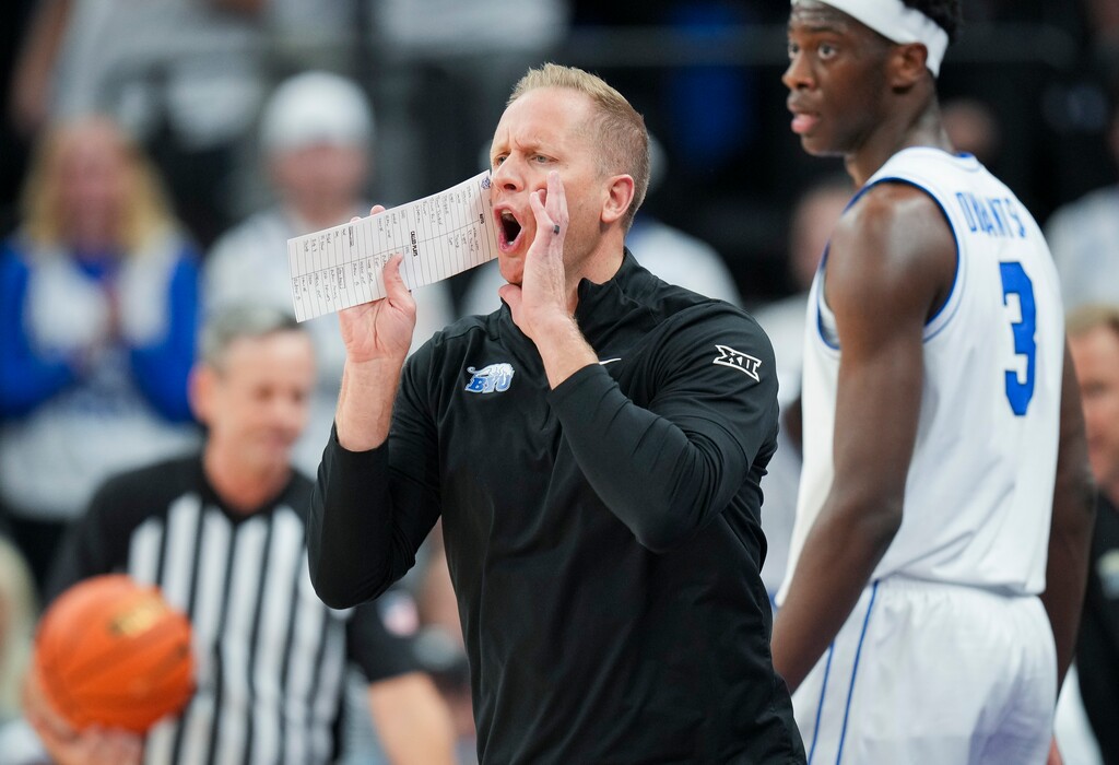 (Bethany Baker  |  The Salt Lake Tribune) BYU Cougars head coach Kevin Young calls out to his team during the game between the BYU Cougars and the North Carolina Tar Heels at Delta Center on Friday, Oct. 24, 2025.
