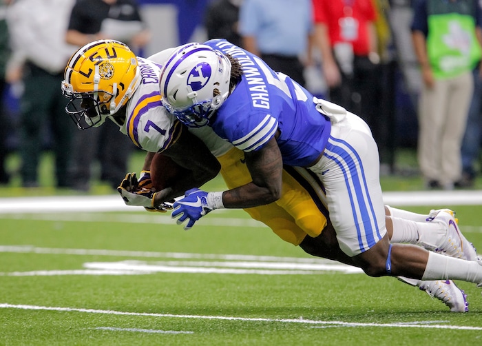 LSU wide receiver D.J. Chark (7) catches a pass against BYU defensive back Dayan Ghanwoloku (5) in the first half of an NCAA college football game in New Orleans, Saturday, Sept. 2, 2017. (AP Photo/Scott Threlkeld)