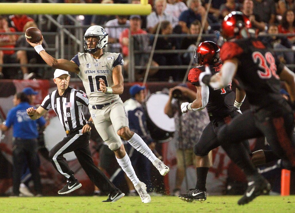 Utah State quarterback Jordan Love throws a pass during the first quarter against San Diego State in an NCAA college football game Saturday, Sept. 21, 2019, in San Diego. Love did not complete a touchdown pass in the game, but the Aggies achieved their first win over the Aztecs in 52 years. (Hayne Palmour IV/The San Diego Union-Tribune via AP)