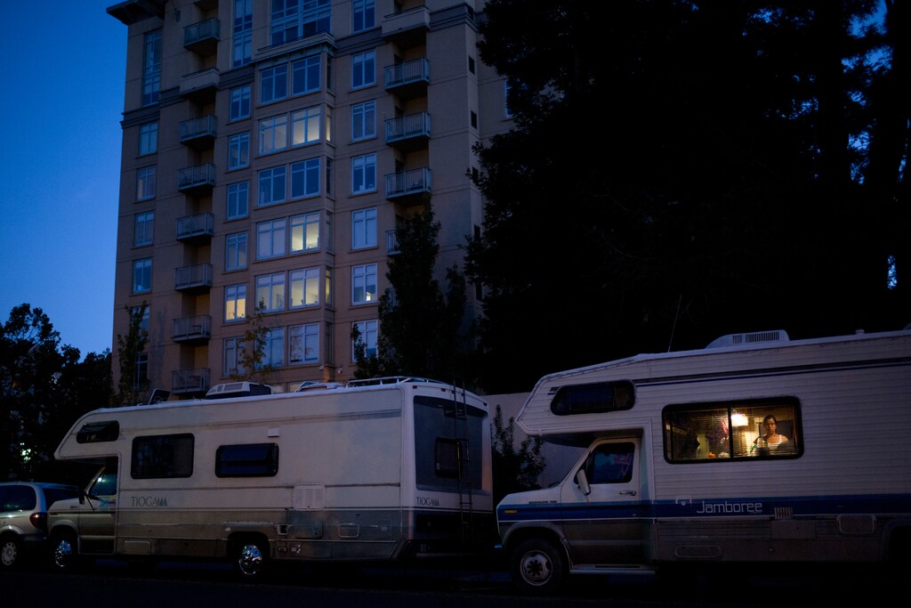 Delmi Ruiz, 41, who is five months pregnant, works in the kitchen area of her RV parked in front of an apartment building, where the monthly rent for a one-bedroom unit is more than $3000, Monday, Oct. 23, 2017, in Mountain View, Calif. Ruiz and her husband, who works as a landscaper earning minimum wage, have been living in the RV for more than two years with their four children after they could no longer afford the rent. (AP Photo/Jae C. Hong)
