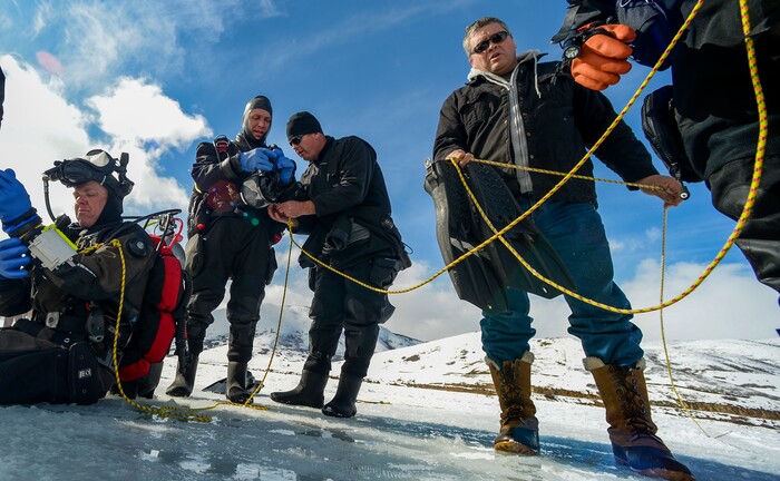 Leah Hogsten | The Salt Lake Tribune l-r Utah Department of Public Safety's Dive Team members Jeff Arbon, Adam Walker, Josh White and Wayne Gifford assist each other with their gear. The Utah Department of Public Safety's Dive Team and the Riverside County Sheriff's Office joined forces for a day of ice diving at Deer Creek Reservoir, Feb. 20, 2019. Twenty members from Riverside County Sheriff's Department dove in icy waters alongside DPS' 10 man team in a joint team training day, Wednesday. Members of the Riverside County Sheriff's were working to become certified in ice diving under the team's lieutenant and dive master. Due to the equipment assets and the unique diver skill sets, dive teams are often called upon to provide assistance to aquatic homicide investigations and accidental drownings.