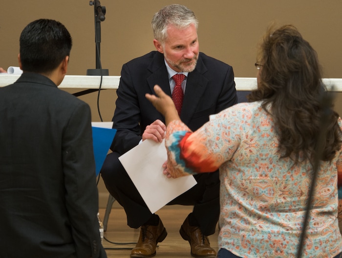 (Leah Hogsten  |  The Salt Lake Tribune)  U.S. District Judge Robert Shelby listens to the opinions of Gina Jim after the hearing in Bluff where Shelby and his redistricting team presented new options for the three commission districts and five school districts. San Juan County residents were presented with proposals of the newly redrawn county commission and school board districts during hearings in Monticello and Bluff, November 16, 2017. The redistricting proposals would redraw voting districts to ensure significant American Indian majorities in two of three County Commission districts and on four of five school board voting districts as the result of a January 2012 lawsuit filed in U.S. District Court by the Navajo Nation. The lawsuit seeks the redrawing of voting districts to reflect the 2010 U.S. Census. Last year, U. S. District Court Judge Robert Shelby ruled the voting districts in the sprawling southeastern Utah county, which today is home to 16,895 residents, are unconstitutional and violate the rights of American Indians. He ordered the county to redraw them.
