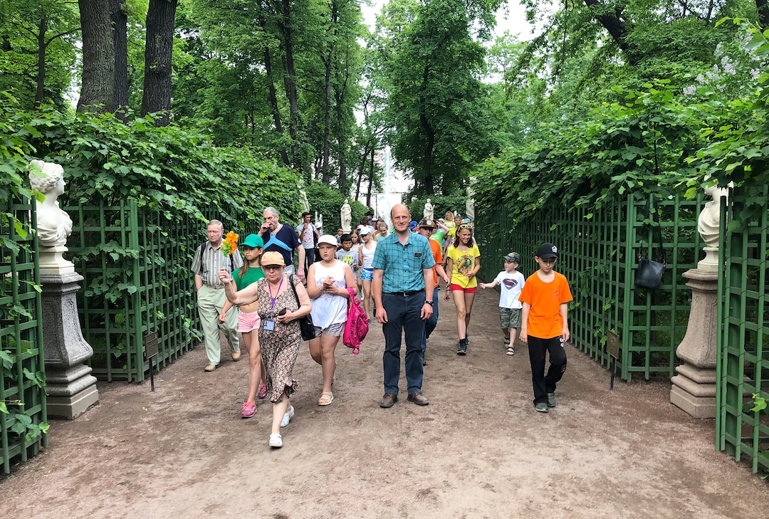 (Michael Stack  |  Special to The Salt Lake Tribune) Mikhail Kotov, center, stands at the LDS Russian dedication site in the Summer Palace Garden in St. Petersburg.