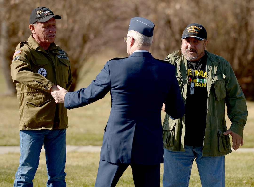 (Leah Hogsten  |  The Salt Lake Tribune) Utah Council President and Chairman of the Public Affairs Committee for the Vietnam Veterans of America Dennis E. Howland, center, greets and thanks fellow veterans for their service during Northern Utah’s 12th Annual Veterans Day Parade Saturday, Nov. 11, 2017 in Layton.