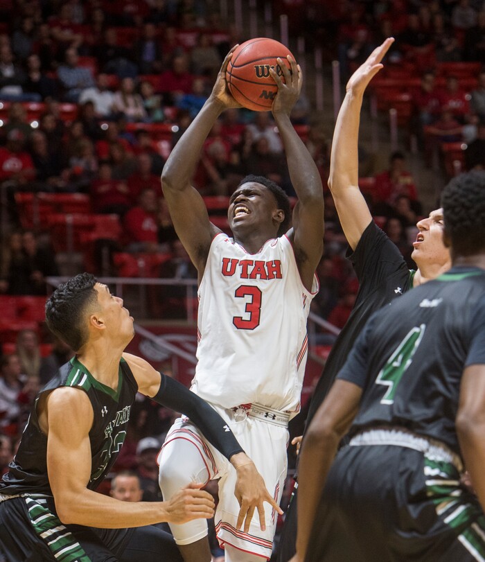 (Rick Egan  |  The Salt Lake Tribune)  Utah Utes forward Donnie Tillman (3) shoots as Hawaii Warriors guard Samuta Avea (32) defends, in basketball action, Utah Utes vs Hawaii Warriors, at the Jon M. Huntsman Center, Saturday, December 2, 2017.