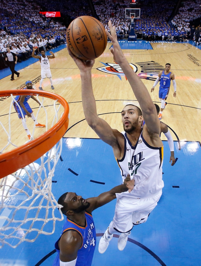 Utah Jazz center Rudy Gobert (27) shoots over Oklahoma City Thunder forward Patrick Patterson, left, during the first half of Game 5 of an NBA basketball first-round playoff series in Oklahoma City, Wednesday, April 25, 2018. (AP Photo/Sue Ogrocki)