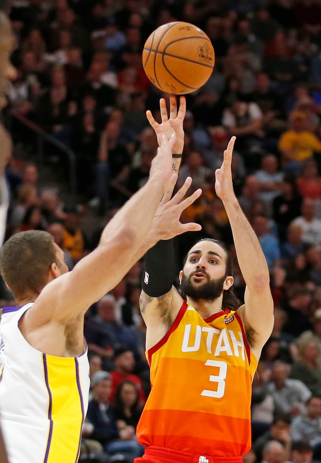 Utah Jazz guard Ricky Rubio (3) shoots as Los Angeles Lakers center Brook Lopez defends during the second half of an NBA basketball game Tuesday, April 3, 2018, in Salt Lake City. (AP Photo/Rick Bowmer)