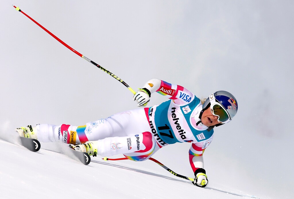 Lindsey Vonn speeds down the course on her way to win an alpine ski, women's World Cup super-G, in St. Moritz, Switzerland, Sunday, Jan. 25, 2015. Lindsey Vonn mastered a tricky super-G race on Sunday for a record-extending 64th World Cup victory. (AP Photo/Marco Trovati)