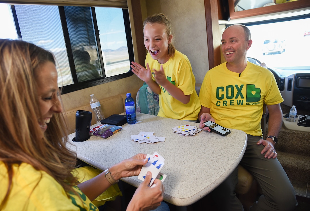 (Francisco Kjolseth  |  The Salt Lake Tribune)  Passing the time between campaign stops, Lt. Gov. Spencer Cox takes in a spirited card game between his wife Abby and their daughter Emma Kate, 12, while touring Box Elder County on Tuesday, July 30, 2019.