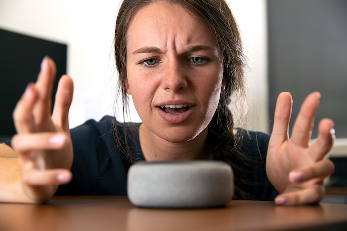 (Photo courtesy of Jaren Wilkey with Brigham Young University) Pictured is a woman jokingly yelling at Amazon's Alexa.