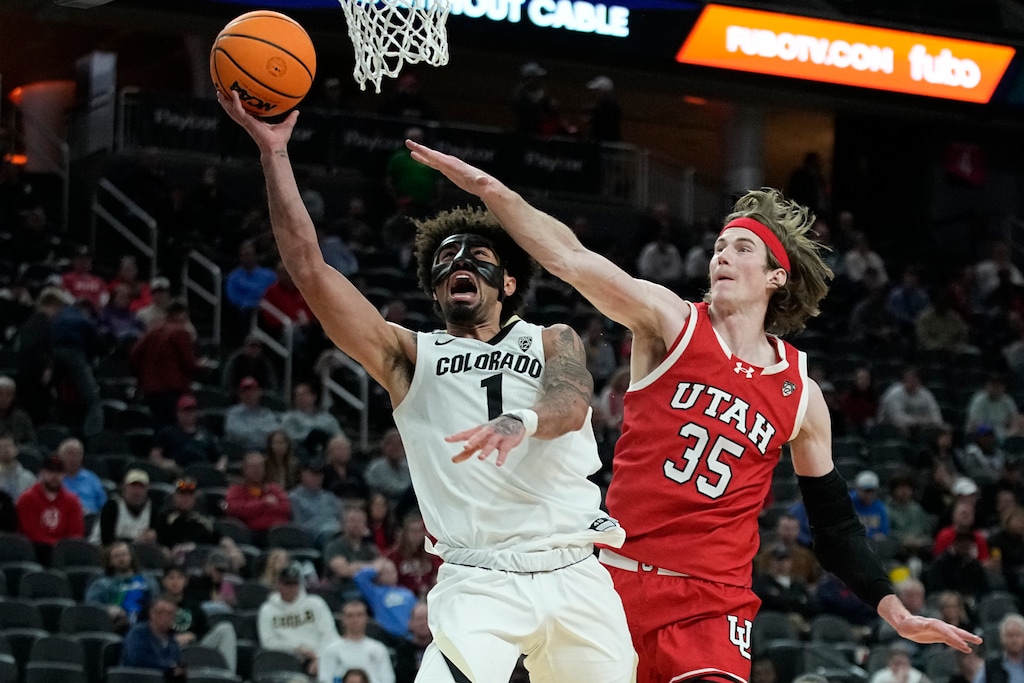 (John Locher | AP) Colorado guard J'Vonne Hadley (1) shoots over Utah center Branden Carlson (35) during the second half of an NCAA college basketball game in the quarterfinal round of the Pac-12 tournament Thursday, March 14, 2024, in Las Vegas.