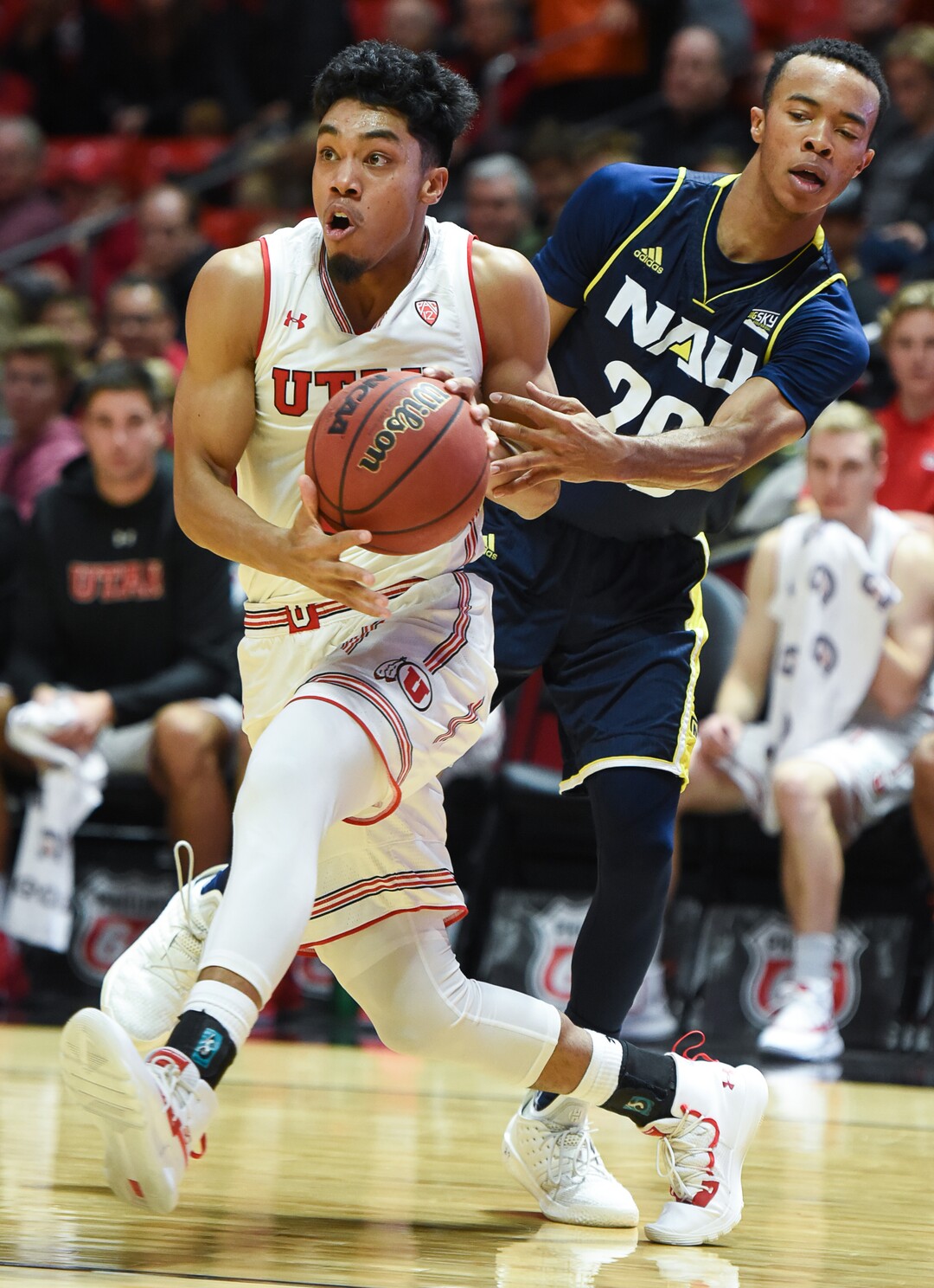 (Francisco Kjolseth  |  The Salt Lake Tribune)  Utah Utes guard Sedrick Barefield (2) pushes past Northern Arizona Lumberjacks guard Cameron Shelton (20) during the second half of an NCAA basketball college basketball game at the Jon M. Huntsman Center in Salt Lake City, Ut., Friday Dec. 21, 2018.