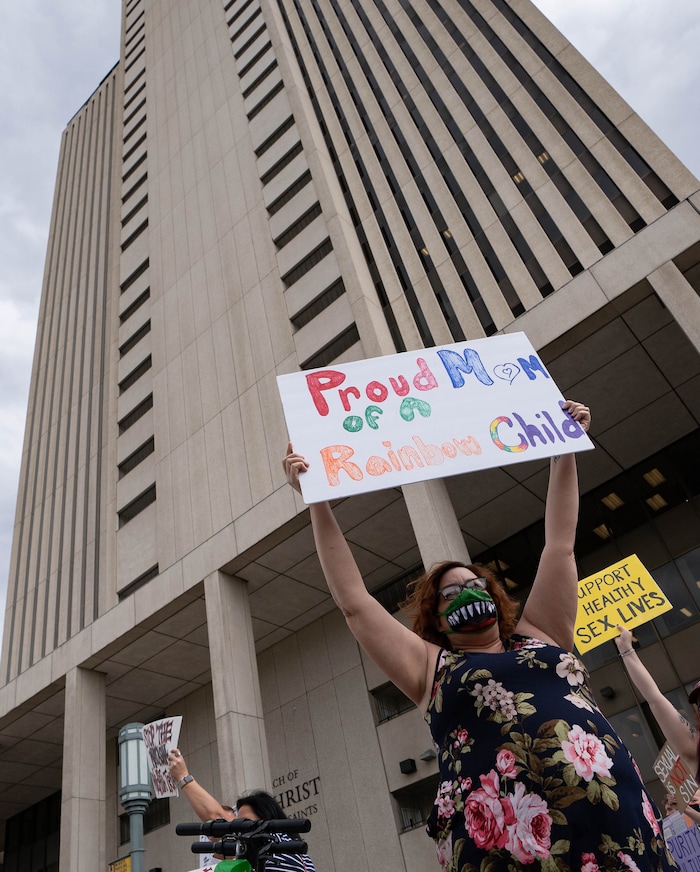 (Francisco Kjolseth | The Salt Lake Tribune) Eva Bell joins dozens of people protesting to petition the First Presidency to repeal the excommunication of Natasha Helfer, a sex therapist who lost her membership in The Church of Jesus Christ of Latter-day Saints. "Out of respect for Natasha, this is a protest against the decision of the council, not a protest against the Church,” as they gathered outside the Church offices in a peaceful protest on Friday, May 7, 2021.