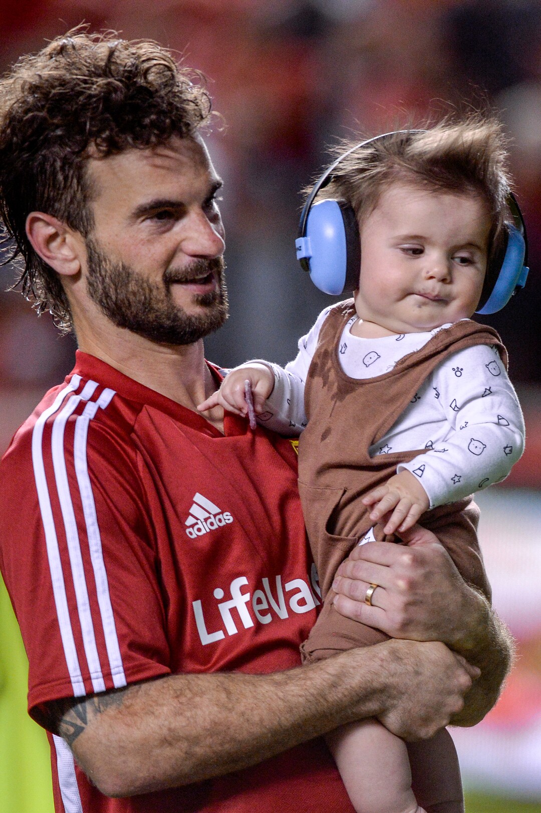 (Leah Hogsten  |  The Salt Lake Tribune) Real Salt Lake midfielder Kyle Beckerman (5) walks around the field celebrating the win with his son Constantine. Real Salt Lake defeated Philadelphia Union 4-0 in MLS Soccer at Rio Tinto Stadium in Sandy, Utah on Sat, July 13, 2019.