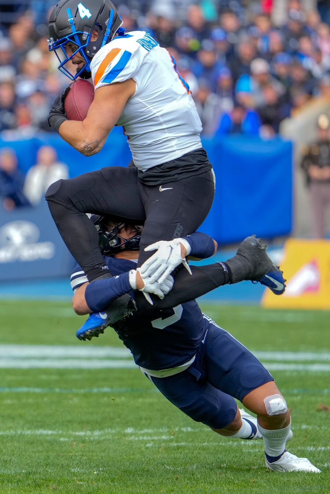 (Leah Hogsten | The Salt Lake Tribune) Brigham Young Cougars linebacker Chaz Ah You (3) tackles Boise State Broncos running back Cyrus Habibi-Likio (4) as No. 10 Brigham Young University hosts Boise State at LaVell Edwards Stadium, Oct. 9, 2021.