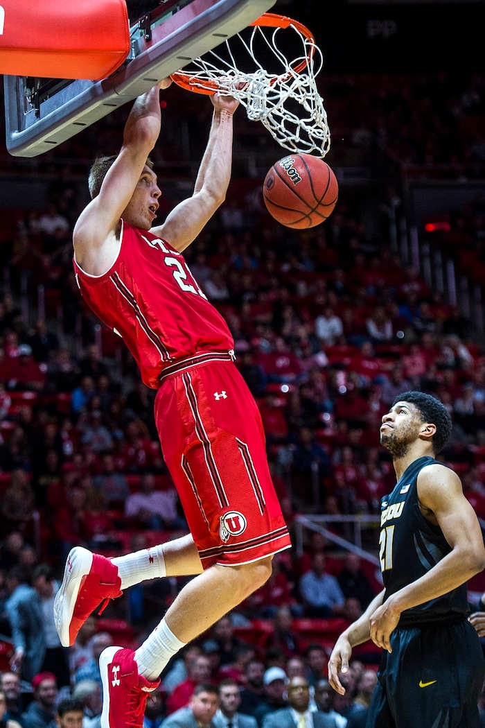 (Chris Detrick  |  The Salt Lake Tribune)  Utah Utes forward Tyler Rawson (21) dunks the ball past Missouri Tigers forward Jordan Barnett (21) during the game at the Jon M. Huntsman Center Thursday, November 16, 2017.   