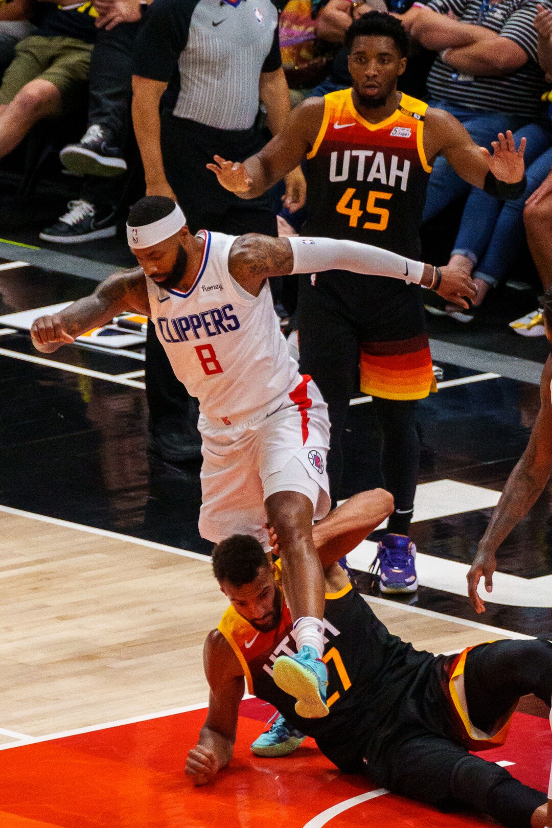 (Trent Nelson  |  The Salt Lake Tribune) LA Clippers forward Marcus Morris Sr. (8) steps over Utah Jazz center Rudy Gobert (27) as the Utah Jazz host the Los Angeles Clippers in a Game 5 matchup, NBA basketball in Salt Lake City on Wednesday, June 16, 2021.