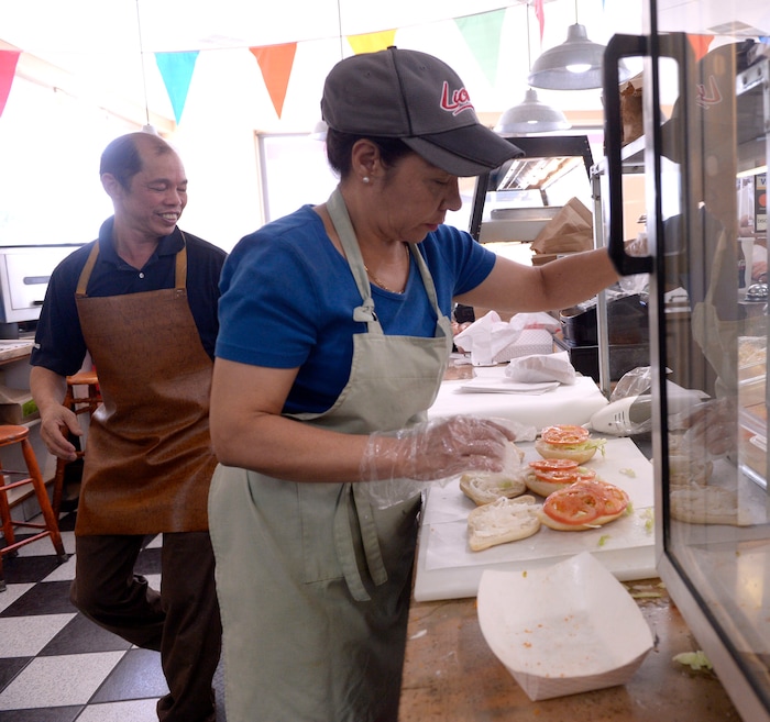 (Al Hartmann | The Salt Lake Tribune) Kevin Nguyen runs the deep fryer in back and his wife Donna handles the front counter and makes chicken sandwiches at Kevin's Fried Chicken, located inside the Food Mart/Gas Station at 524 W. 4500 South in Murray.