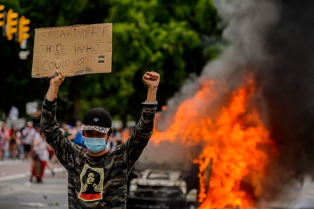 (Trent Nelson  |  The Salt Lake Tribune) A police car burns in Salt Lake City on Saturday, May 30, 2020.