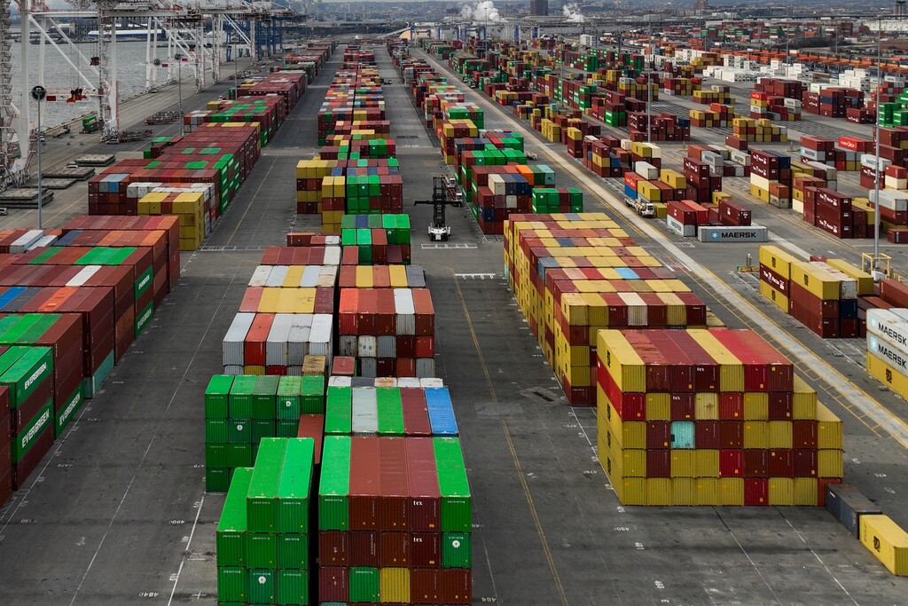 (Erin Schaff | The New York Times) Containers are stacked at the Port of Baltimore, Feb. 22, 2025.