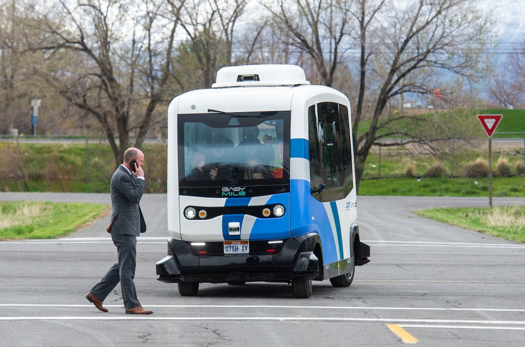 (Rick Egan  |  The Salt Lake Tribune)   Lt. Governor Spencer J. Cox walks in front of an Autonomous Shuttle, to see if it will stop for him, during a demonstration as the Utah Department of Transportation, in partnership with the Utah Transit Authority, launched a new Autonomous Shuttle Pilot Project at the test track is across the street from UDOT headquarters on the west side of 2700 West. Thursday, April 11, 2019.